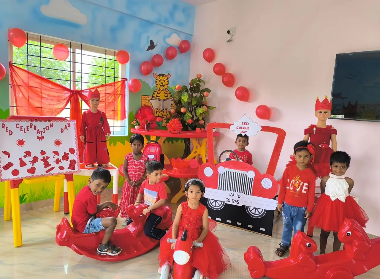 Children with their teacher at CMR International School